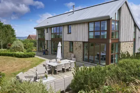 Patio area at Sleeps 10, Gold Award Winning House, M1 rated, ideal for all generations with downstairs bedroom and wet room, Herefordshire