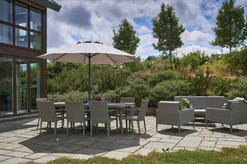 Patio area at Sleeps 10, Gold Award Winning House, M1 rated, ideal for all generations with downstairs bedroom and wet room, Herefordshire