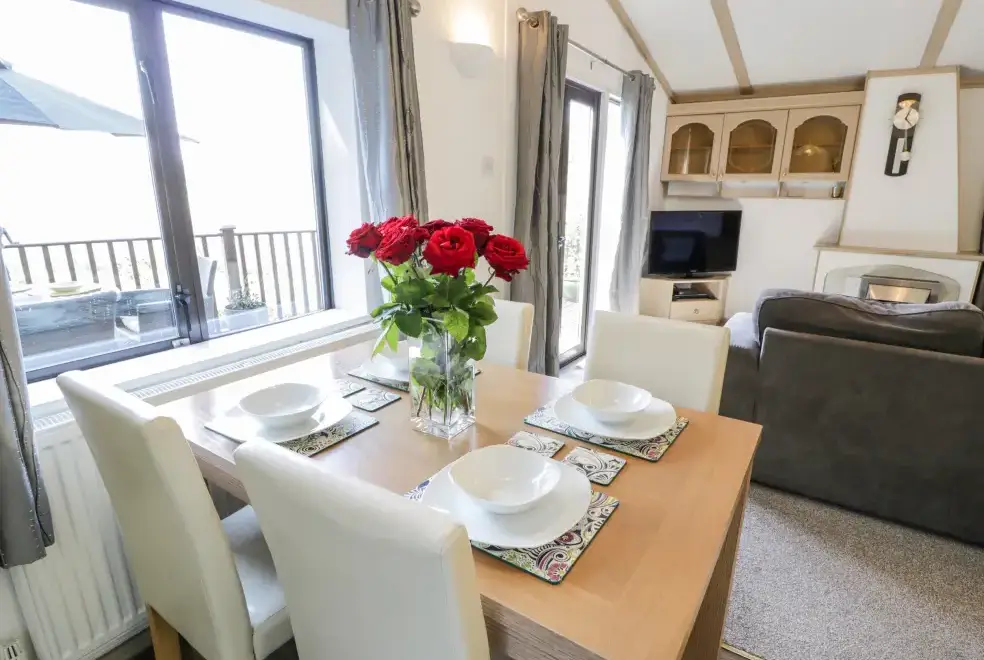 Open plan living area at Springtime Log Cabin