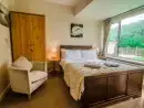 Bedroom at Symonds Yat Lodge - thumbnail photo