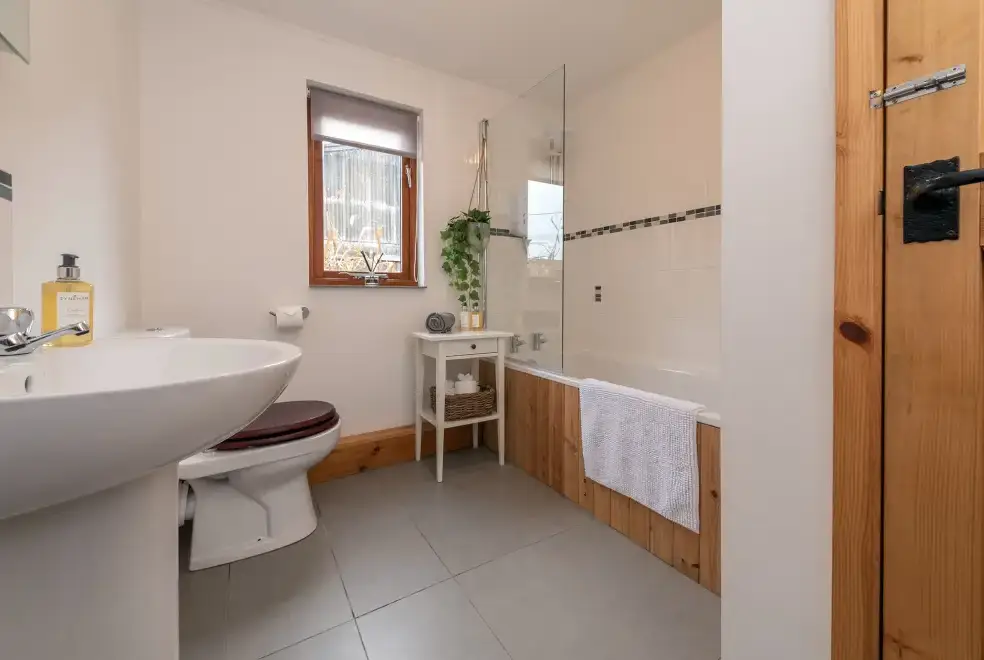 Family bathroom at The Barn with hot tub