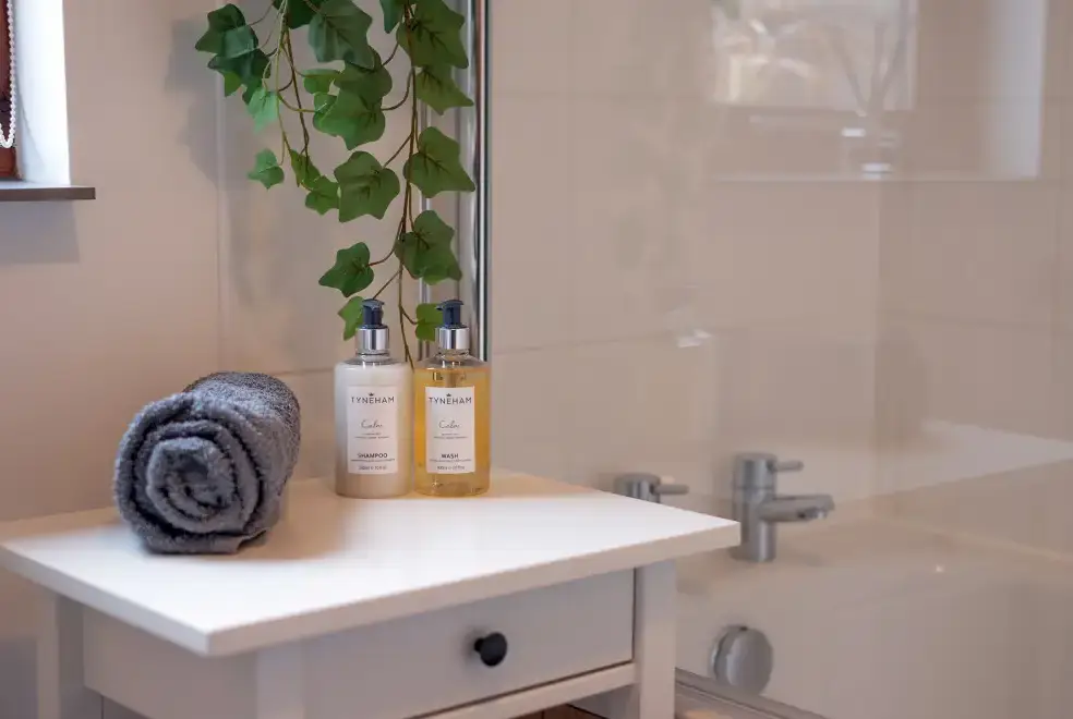 Ensuite bathroom at The Barn with hot tub