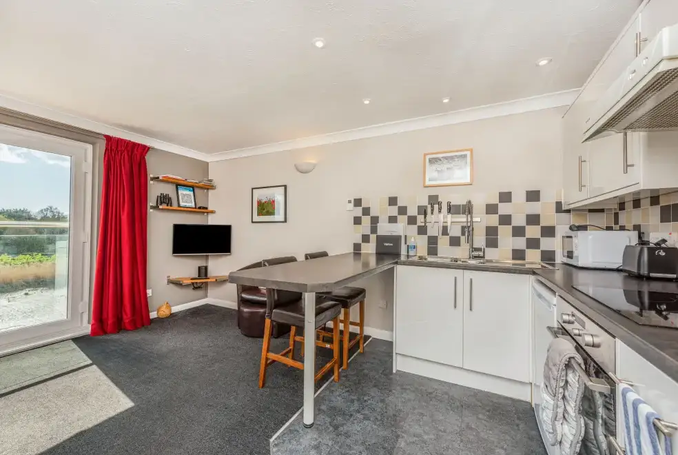 Open plan living area at The Boathouse Romantic Apartment