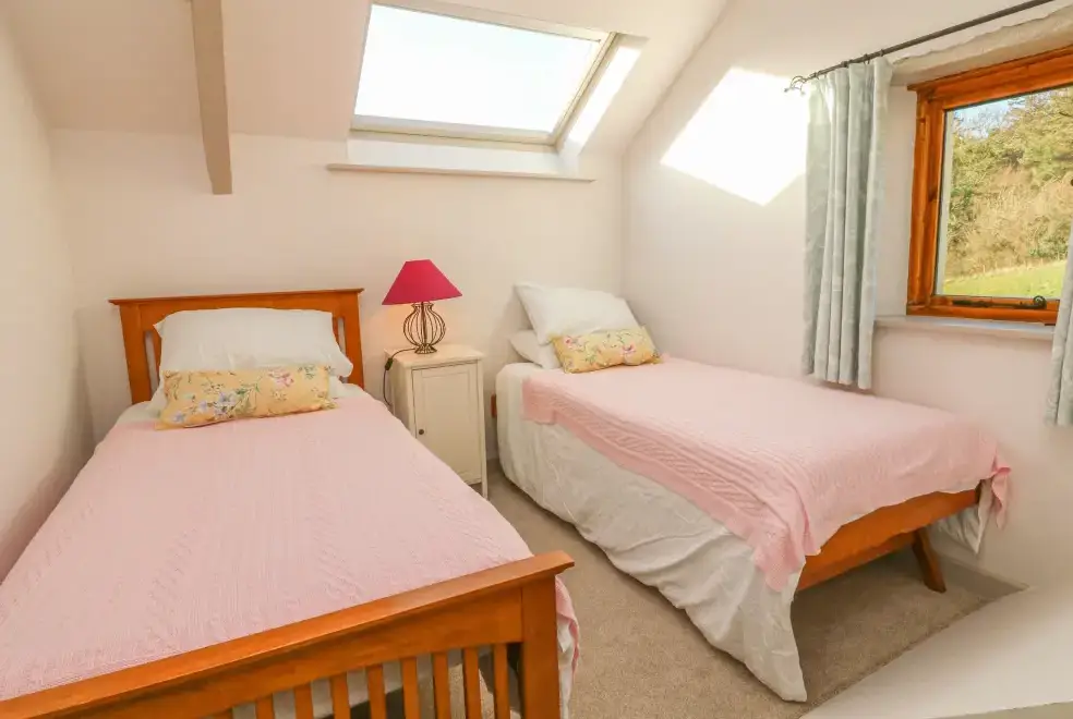 Bedroom at The Byre Coastal Cottage, South West England 