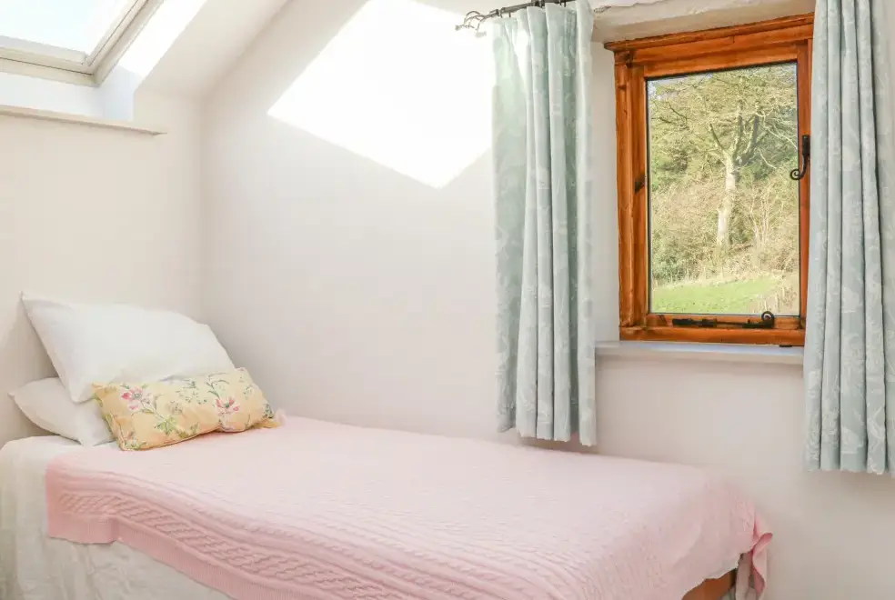 Bedroom at The Byre Coastal Cottage, South West England 