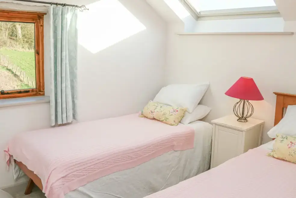 Bedroom at The Byre Coastal Cottage, South West England 