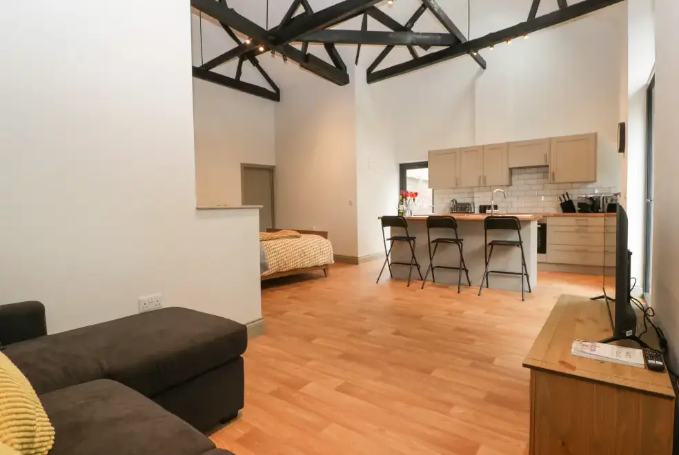 Open plan living area at The Coach House Romantic Retreat