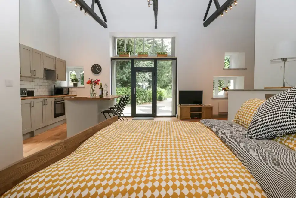 Open plan living area at The Coach House Romantic Retreat