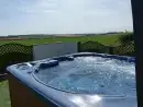 Outdoor hot tub at The Cornmill  - thumbnail photo