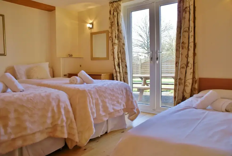 Bedroom at The Cotswold Manor Lodge, Exclusive Hot-Tub, Games Barn, 70 acres of Parkland