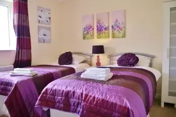 Bedroom at The Cotswold Manor Lodge, Exclusive Hot-Tub, Games Barn, 70 acres of Parkland