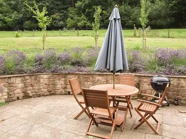 Patio area at The Lodge Farm Barn, Heart Of England
