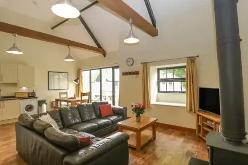 Open plan living area at The Old Stables Holiday Barn, Dorset