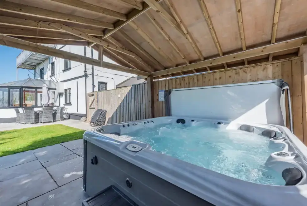 Outdoor hot tub at Trebrowen