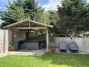 Outdoor hot tub at Trebrowen - thumbnail photo
