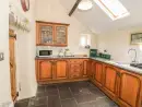 Farmhouse style kitchen at Ty Fferm Bodlasan - thumbnail photo