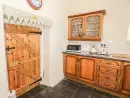 Farmhouse style kitchen at Ty Fferm Bodlasan - thumbnail photo