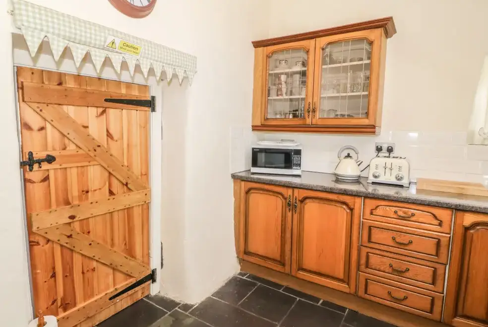 Farmhouse style kitchen at Ty Fferm Bodlasan