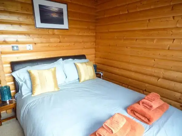 Bedroom at Ty Pren Pet-Friendly Log Cabin, South Wales 