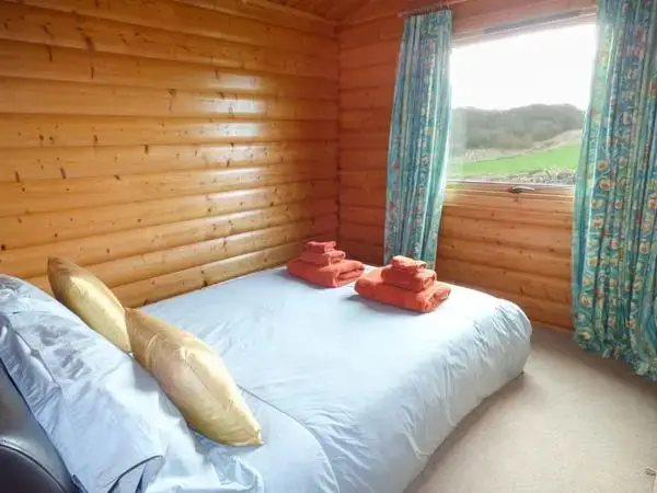 Bedroom at Ty Pren Pet-Friendly Log Cabin, South Wales 