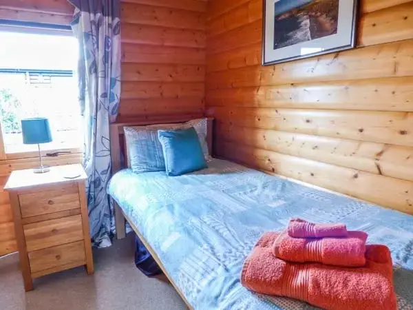 Bedroom at Ty Pren Pet-Friendly Log Cabin, South Wales 
