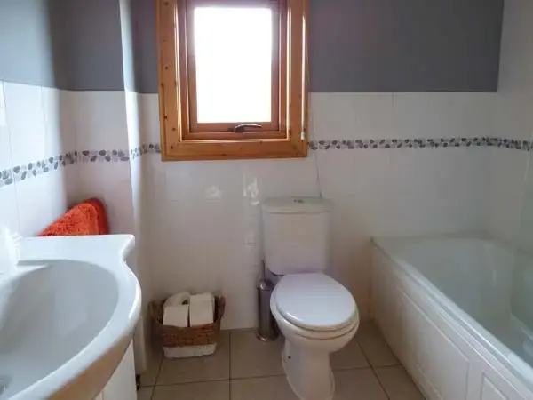 Family bathroom at Ty Pren Pet-Friendly Log Cabin, South Wales 