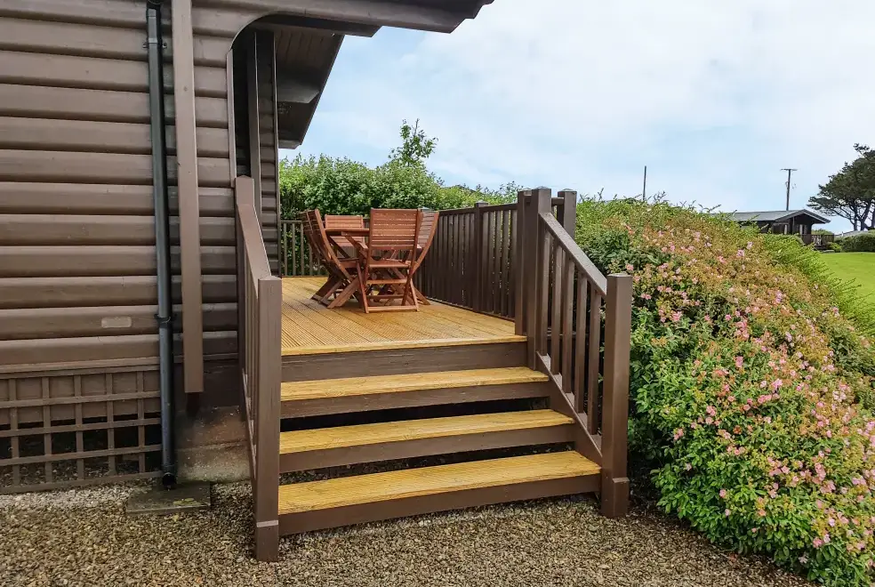 Decked area at Ty Pren Pet-Friendly Log Cabin, South Wales 