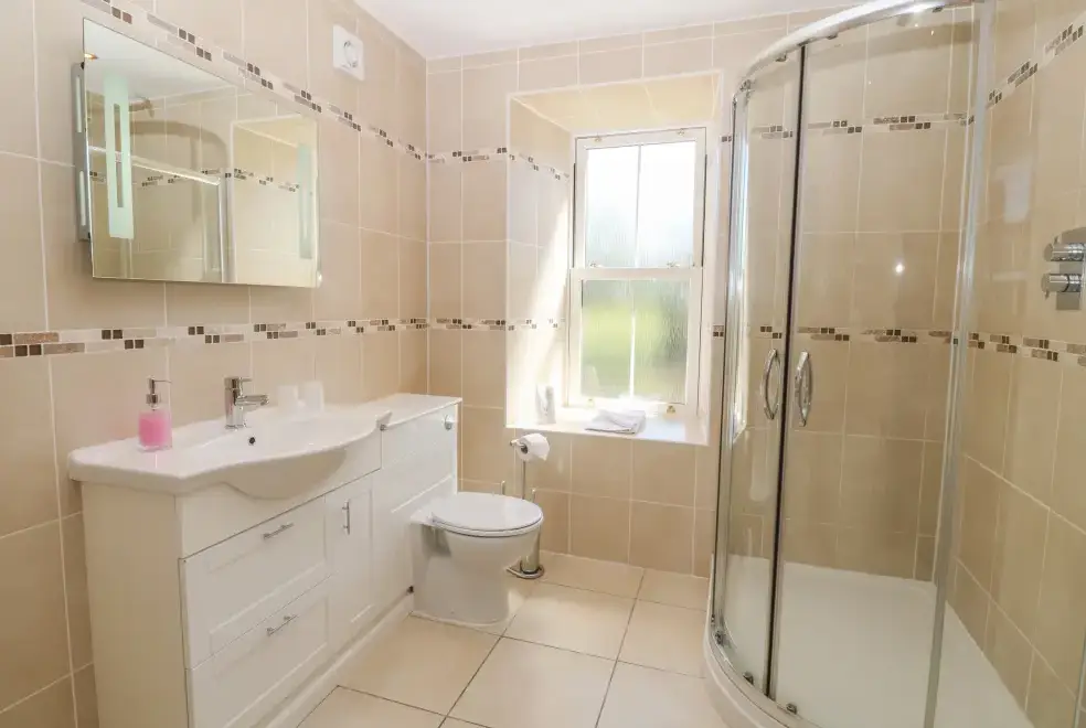 Shower room at Tyddyn Goronwy Beach Cottage, Coastal Snowdonia