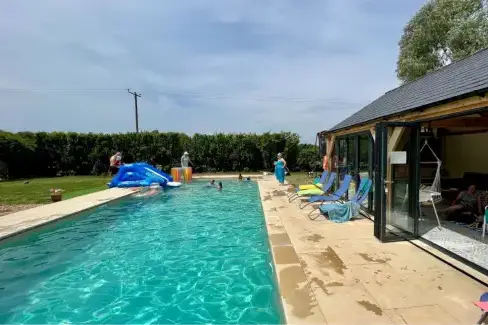 Outdoor swimming pool at Waterperry Cottage at Oxford Country Cottages, Oxfordshire