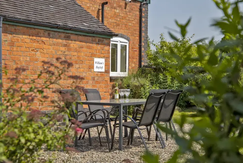 Garden furniture at William's Hayloft with Swimming Pool, Sports Court & Toddler Play Area