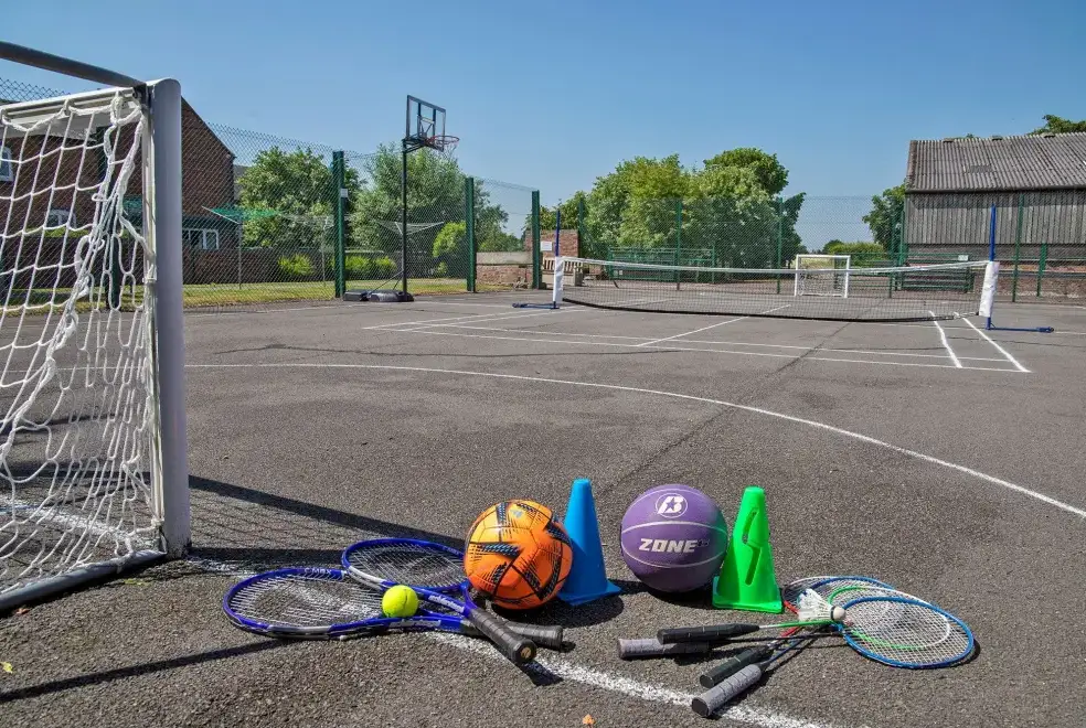 Outdoor games area at William's Hayloft with Swimming Pool, Sports Court & Toddler Play Area