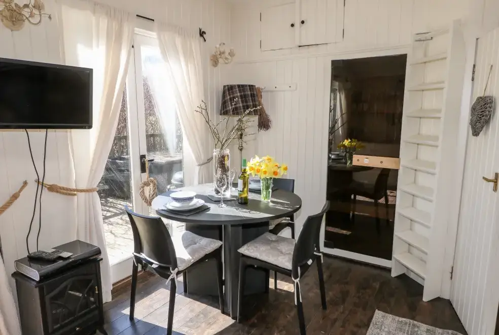 Dining room at Woodmancote Holiday Lodge
