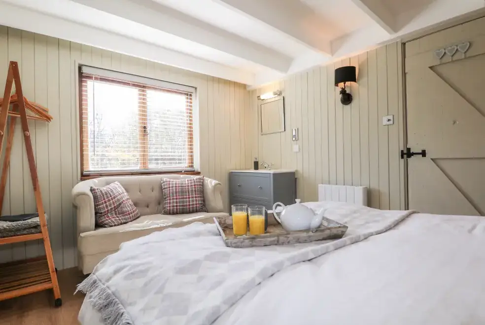 Bedroom at Woodmancote Holiday Lodge