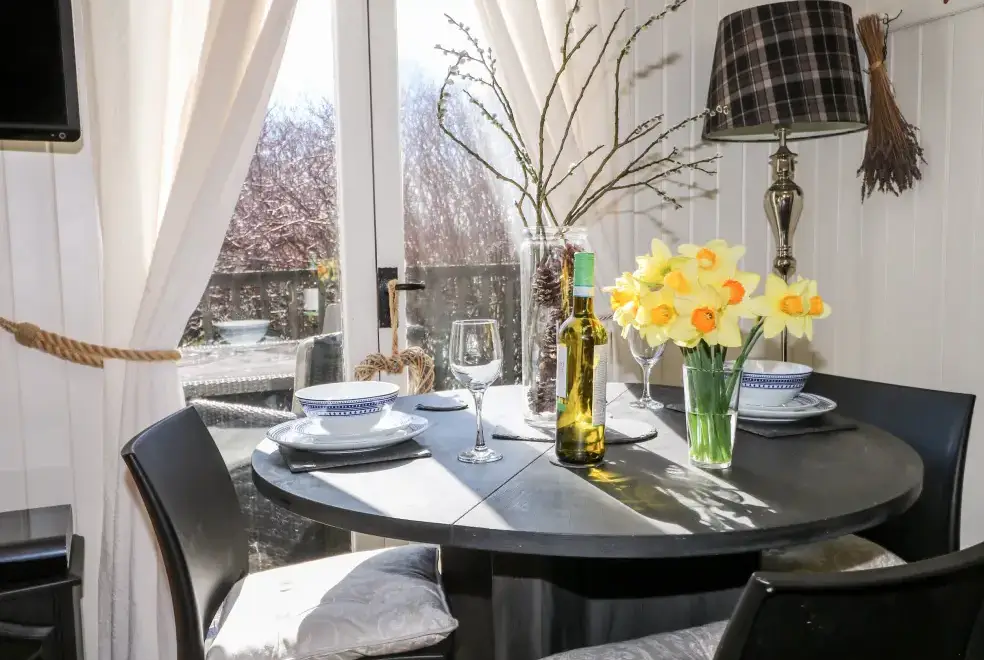 Dining room at Woodmancote Holiday Lodge