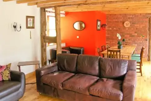 Open plan living area at Y Sgubor Holiday Barn, Powys